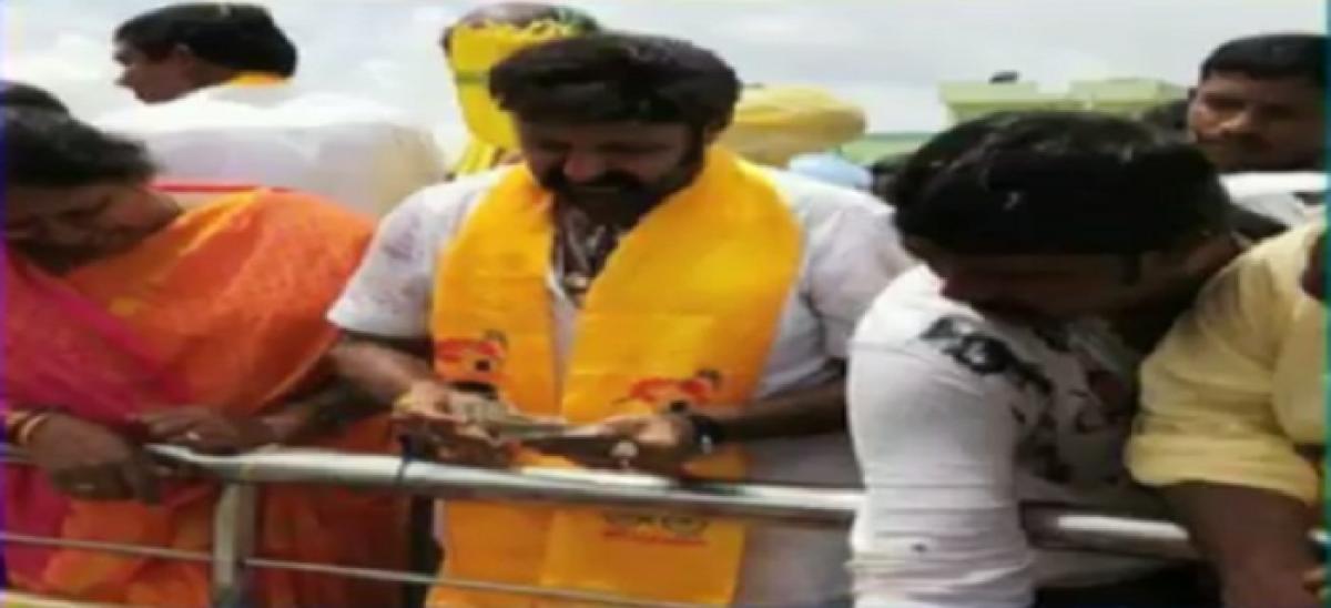 Nandyal by-polls: Hindupur MLA Balakrishna distributes money at road show